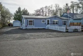 A fenced front yard area and tons of parking with low maintenance exterior care.