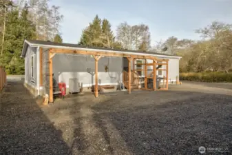 The rear of the home has a 220 outlet for a hot tub, a covered patio area and catio.