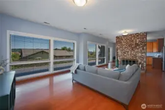 Large recreation room on lower level features a second kitchen, 3/4 bath, gas fireplace, and separate w/d unit which provide for flexible living and MIL potential.