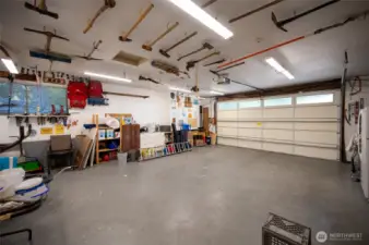 Two car garage / workshop plus additional guest parking by lower entrance. 158th Lane is a private road that accesses in or out onto 41st Avenue through a private gate.