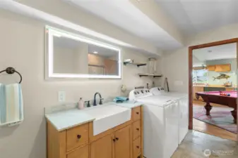 The 2nd laundry area is located in the daylight basement .  The washer and dryer stay with the home