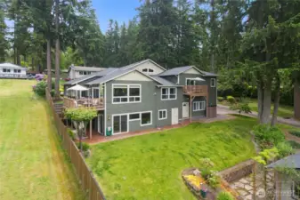 Sliding doors open to lake and privide access to the potential private multi -gen or additional living space. The other doors lead to the mechanical room (where two furnaces and fire suppression system are located) and garage