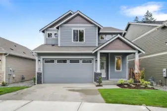 The Hazel on lot 57 offers 2611 sq ft, 5 beds, 3.5 baths with a junior suite located on the main level. Photo from a similar plan on a different lot for reference only. Home is estimated to be completed on 8/22/25