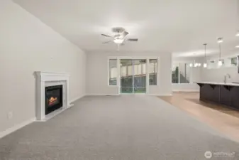 Great room looking back to kitchen and dining room offers fantastic space for entertaining. Large slider door off great room leads to the backyard