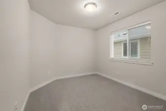 Third bedroom on upper floor features a walk-in closet