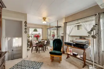 Dining Room, lots of windows to bring in natural light. Basement can be accessed from the outside, potential of a separate living area.