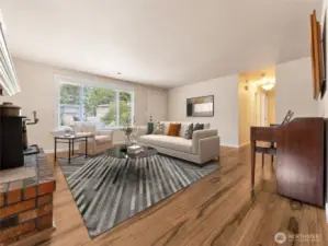 Spacious Living Room with Wood Burning Fireplace.