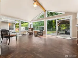 Incredible Sun Room with Concrete Floors and 2 Sliders to your Private Backyard.