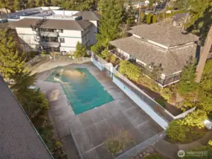 View of Swimming Pool and Clubhouse to the right. Summer is coming, grab your suit and towel.