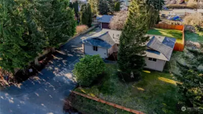 Look at all this space. Large, fenced back yard and direct access to-car shop.