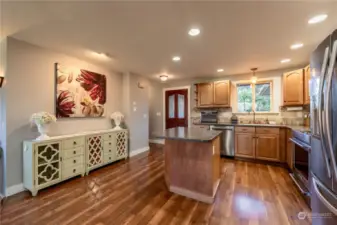 Open kitchen into front room for ease of gathering with friends.