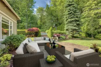 Digitally staged furnishings provide outdoor seating to enjoy the privacy of your backyard oasis.