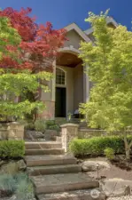 Custom stamped concrete entryway add a level of sophistication.