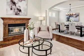 The warm gas fireplace provides a peaceful ambiance for the living room and dining room.