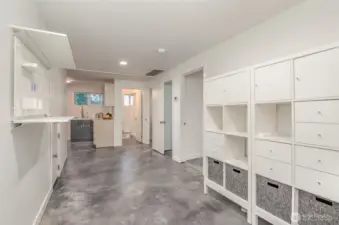Sweeping lower level with kitchen, bathroom bedroom spaces