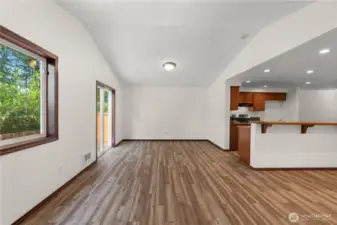 Stunning vaulted ceilings and large window flood the space with abundant natural light.