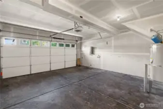 Spacious garage with new garage door & smart garage door opener.