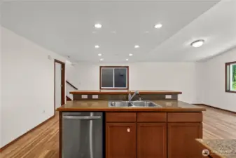 Spacious island features a sink, brand new dishwasher, and plenty of storage—perfect for meal prep and casual gatherings.
