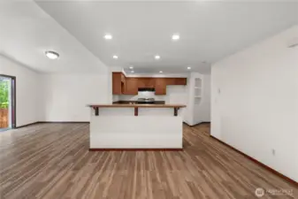 The opposite side of the island offers convenient seating—ideal for quick meals, morning coffee, or socializing while cooking.