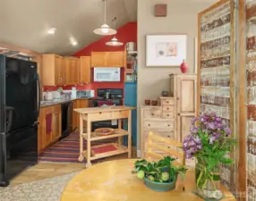 Open floor plan maximizes the space and feels cozy and efficient. Note the vaulted ceilings throughout the main living areas.