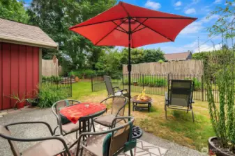 Sweet patio with its own enclosed yard. Hot tub enclosure can be seen to left; DADU is behind the fence.