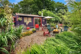 Secret back garden & deck of DADU. Can you believe how much this property offers?