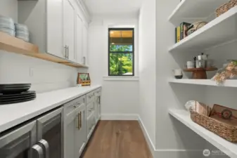 Butlers pantry with beverage fridge