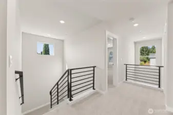 Open and airy upstairs landing, with 2 story entry!