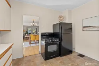 Kitchen flows into the living dining area to one side, and the sun room to the rother side.