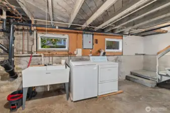 full sized laundry is here along with a double sided utility sink.  Easy plumbing access for any future remodels.