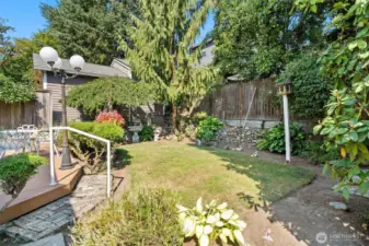 Well-kept back yard, thoughtful plantings.