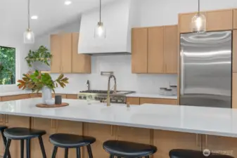 custom hood, designer lighting fixtures, under island storage