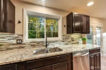 Kitchen overlooks the private backyard!