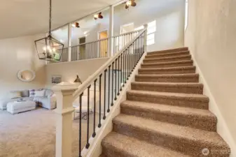 Welcoming staircase to the 3 perfect upstairs bedrooms.