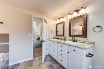 Luxurious 5-piece primary bath with soaking tub, separate shower, dual sinks, and elegant finishes—your own private retreat.