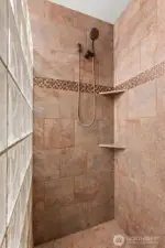 Beautiful tiled walk-in shower in primary bath