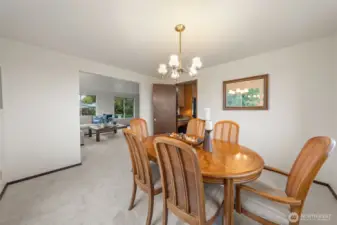 The formal dining room offers ample space for a full-size table and buffet, as shown. Located just off the kitchen, it provides convenient access for entertaining and gathering.