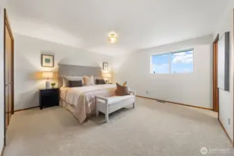 Welcome to the Primary Suite. It features wall-to-wall carpet, fresh paint, and a private bath.