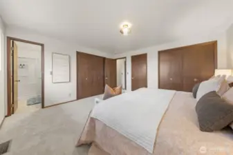 The Primary Suite offers generous dual closet space and fresh carpeting throughout. An updated en-suite bath features a walk-in shower and modern finishes.