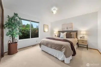 Bedroom Three offers wall-to-wall carpeting, fresh neutral paint, and a generously sized closet.