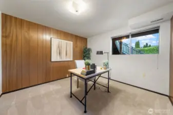 Bedroom Five is located on the lower level as well! It features new carpet, wood paneling, and ample closet space!