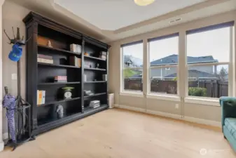 Versatile flex room just off the entry can easily serve as a formal living room, dining room, library, or reading retreat. A welcoming space that adapts beautifully to your lifestyle needs.