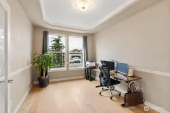 Light-filled main floor office offers a quiet and functional workspace with engineered hardwood floors and excellent natural light. Ideal for working from home, studying, or managing daily life with privacy just off the main living areas.