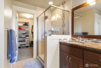 The primary bathroom features a separate toilet room, ample cabinet and counter space, tile work, large window with privacy blinds, soaking tub and so much more!