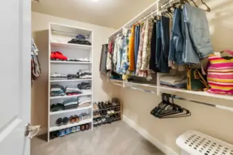 Spacious primary suite walk-in closet.