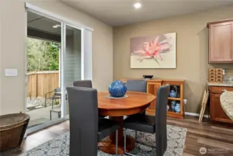 Slider opens up to covered back patio and low maintenance yard