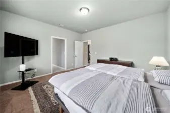 Though the door on the left is the primary bathroom and walk in closet