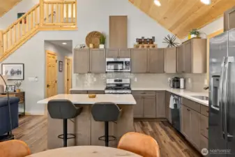 The kitchen island offers a convenient spot for a quick meal before venturing out to enjoy year-round activities in this vacation paradise.