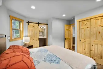 The primary bedroom, located on the main floor, provides easy access and comfort for everyone