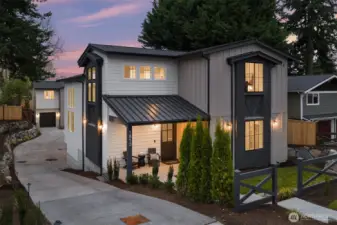 Transitional  design blending modern clean lines with timeless achiterctural elements  and a welcoming covered entry.